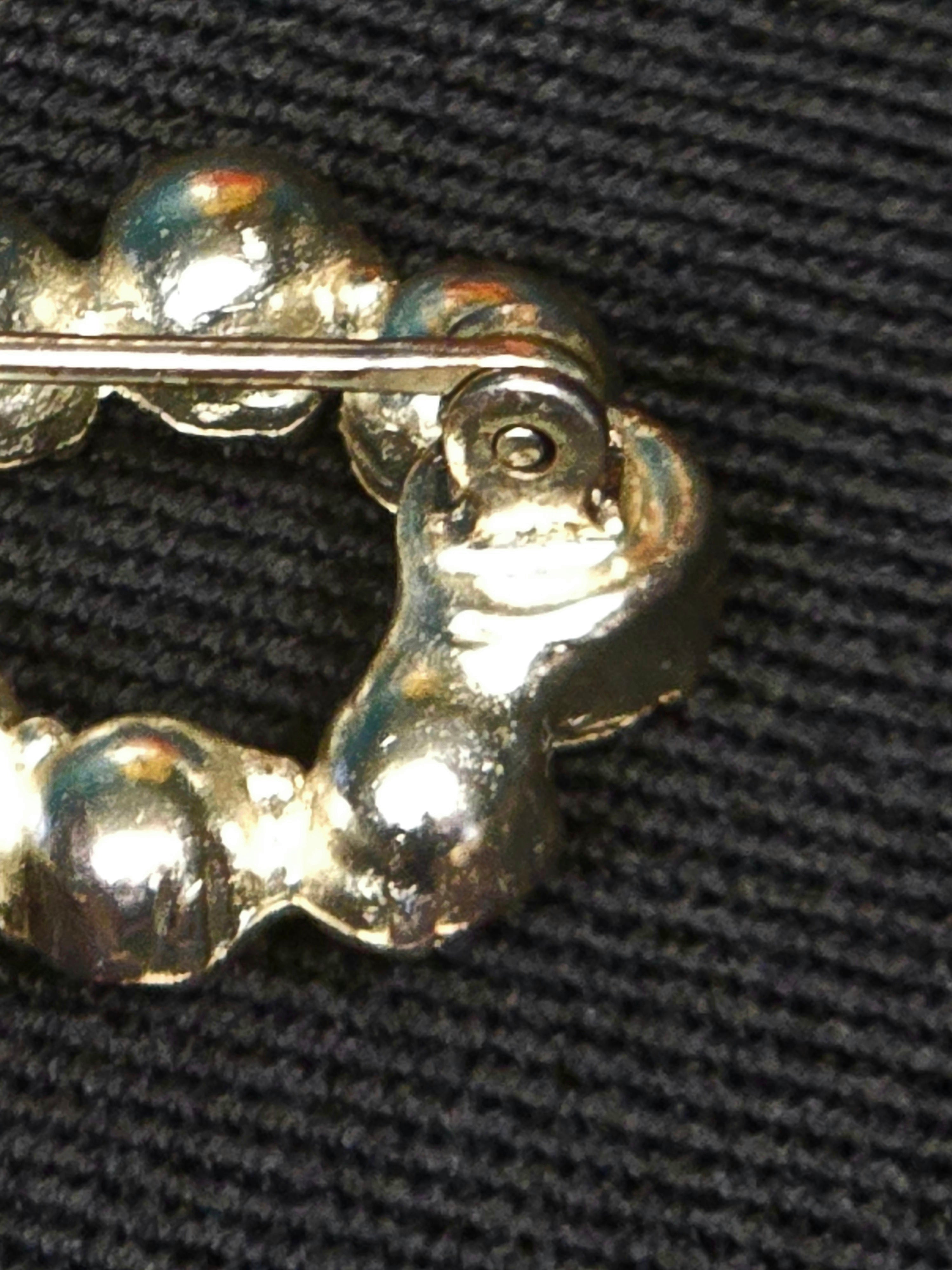 YSL broche coeur et noeud